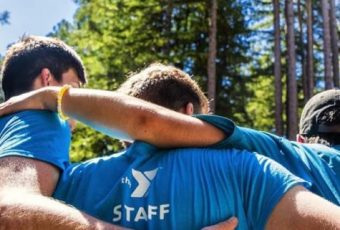 camp staff embracing outdoors